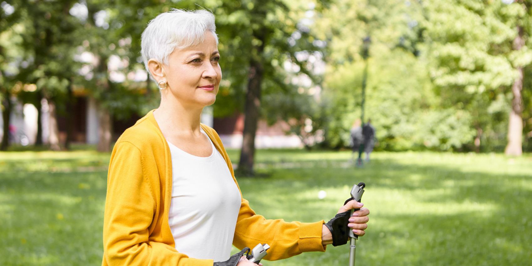 mature people aging sports well being concept beautiful stylish elderly woman choosing healthy active lifestyle retirement spending morning outdoors enjoying scandinavian walking 1
